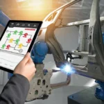 An egineer looking at Predictive Maintenance Analytics dashboard on his phone